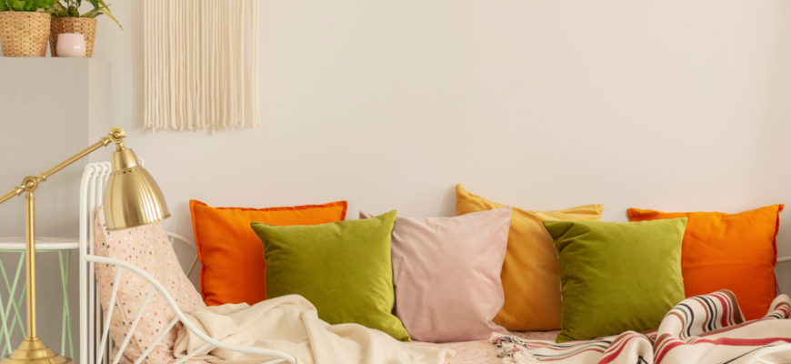 Golden,Lamp,On,The,Nightstand,Next,To,Olive,Green,,Pastel